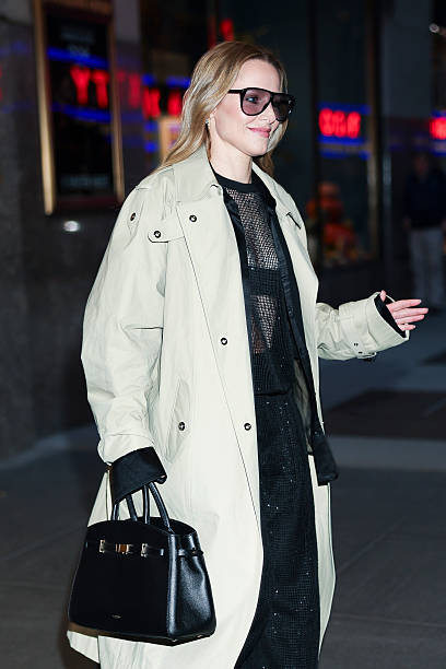 Outerwear Spotlight Beige Trench Coat Defines Classic Celebrity Style