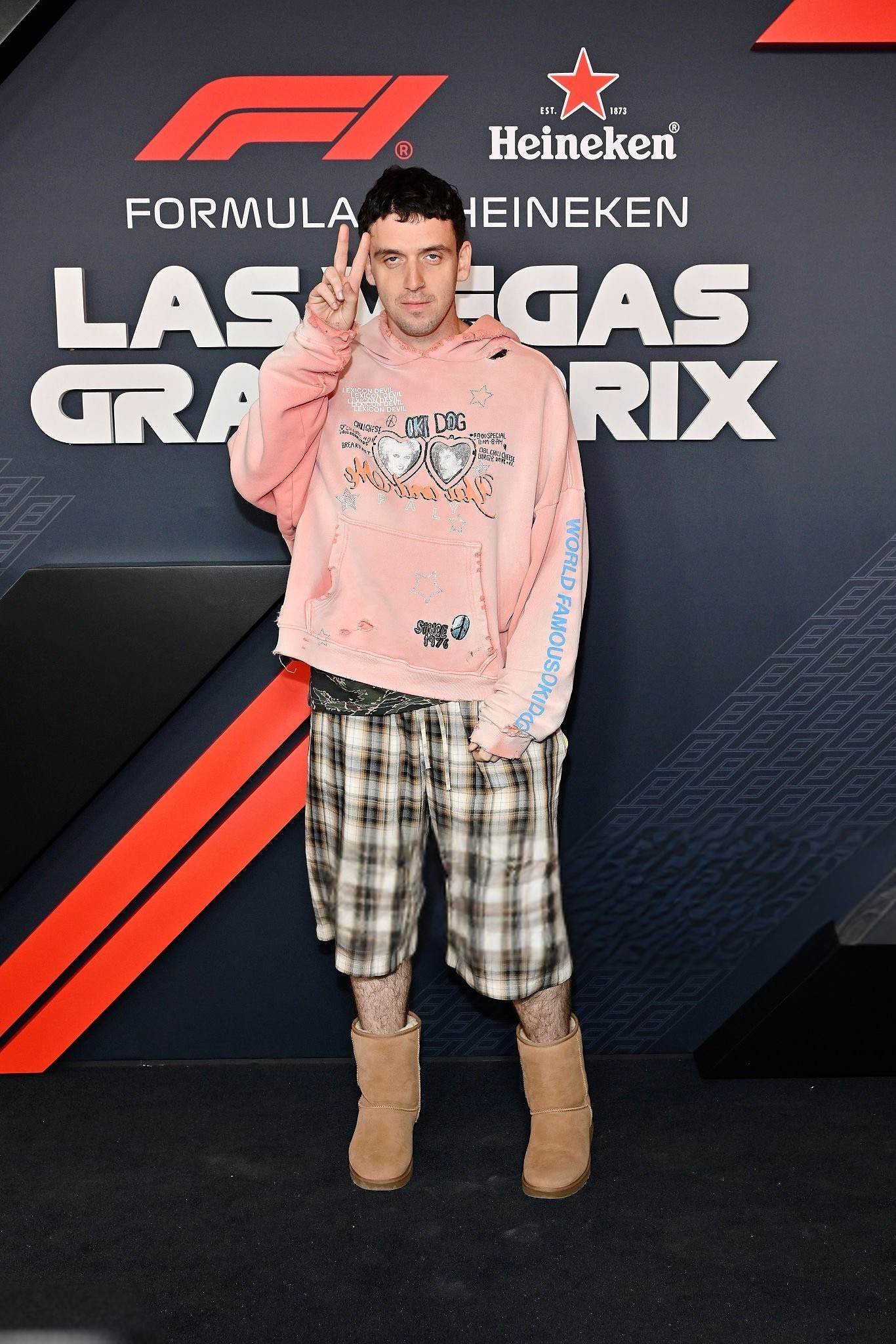 Lauv’s Pastel Pink Hoodie & Plaid Shorts Look Breakdown