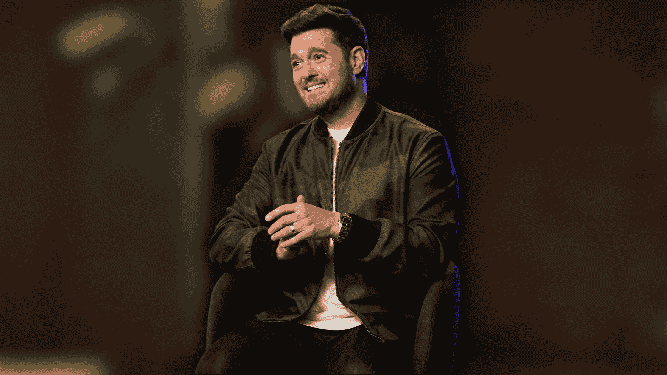 michael-bubl-in-a-green-camo-bomber-jacket-on-the-voice-season-28